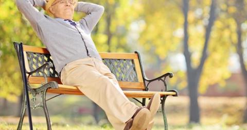 old man relaxing on a park bench